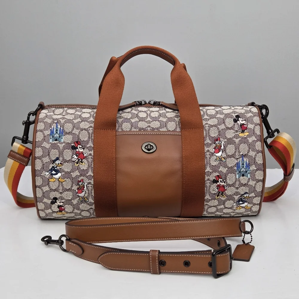 DISNEY X COACH DUFFLE BAG - SIGNATURE TEXTILE JACQUARD MICKEY MOUSE AND FRIENDS